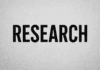 Ransomware hackers show more interest in data exfiltration and less in encryption Bold black typography spelling RESEARCH on gray wall