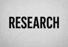 Bold black typography spelling RESEARCH on gray wall