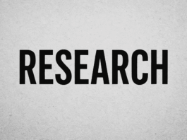 Bold black typography spelling RESEARCH on gray wall