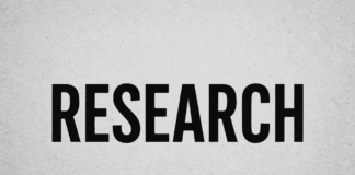 Bold black typography spelling RESEARCH on gray wall