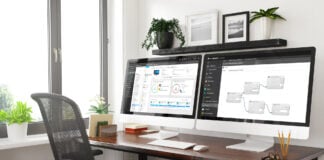 Modern desk with dual monitors running security tools