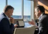 Forrester: Missing AI Governance Could Cost a CEO Their Job in 2027 Two executives in business attire sit at a polished boardroom table, discussing a tablet displaying a chat panel.