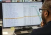 Software Supply Chain Security Miss Drained $3M from Polymarket A person with glasses views a brightly lit code editor displaying a JavaScript dependency list, with one entry highlighted in amber.