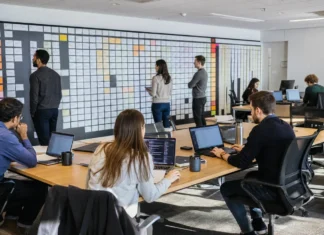 One Cyberattack Now Triggers Hundreds of Breach Reporting Obligations A spacious office with a long table of laptops, people working