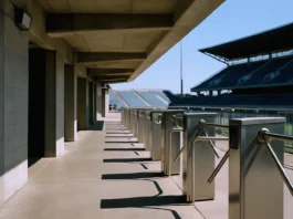 Empty stadium concourse in bright daylight, featuring