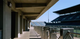 Empty stadium concourse in bright daylight, featuring