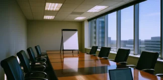 Brightly lit corporate boardroom with a polished conference