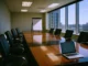 CISO Board Reporting: Gartner Says Drop the Dashboard, Use Financial Statements Brightly lit corporate boardroom with a polished conference