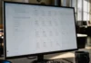 Forrester Names AI Agent Threats the Top 2026 CISO Risk A desktop monitor displays an AI assistant workspace