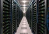 CISA KEV Catalog Adds Seven Exploited Flaws Across AI Stacks and VPNs A long aisle in a brightly lit data center, lined with rows of rack-mounted network appliances and neatly routed cables.