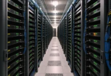 CISA KEV Catalog Adds Seven Exploited Flaws Across AI Stacks and VPNs A long aisle in a brightly lit data center, lined with rows of rack-mounted network appliances and neatly routed cables.