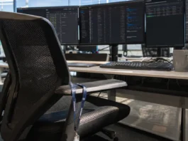 Finance Lets AI Security Automation Act Alone; Attackers Use AI Right Back A close-up of an empty operator's chair at a security