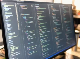 Gentlemen Ransomware Builds Modular EDR Killer Suite From Rival Gang Tools Close-up of a brightly lit computer screen displaying a code editor with multiple panes of disassembly output and hex values.