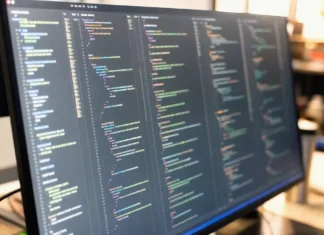 Gentlemen Ransomware Builds Modular EDR Killer Suite From Rival Gang Tools Close-up of a brightly lit computer screen displaying a code editor with multiple panes of disassembly output and hex values.