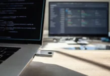 Unit 42: Edge Exploits Lead September 2026 Initial Access Vectors Close-up of a hardware security key being inserted into a laptop's USB-C slot on a brightly lit desk.