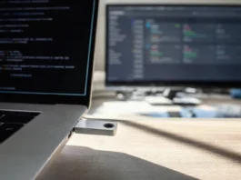 Unit 42: Edge Exploits Lead September 2026 Initial Access Vectors Close-up of a hardware security key being inserted into a laptop's USB-C slot on a brightly lit desk.