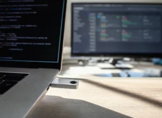 Unit 42: Edge Exploits Lead September 2026 Initial Access Vectors Close-up of a hardware security key being inserted into a laptop's USB-C slot on a brightly lit desk.